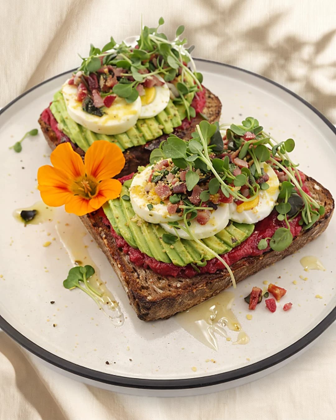 Harvest Toast — sourdough with beet hummus, avocado, egg and micro greens, as served at the café